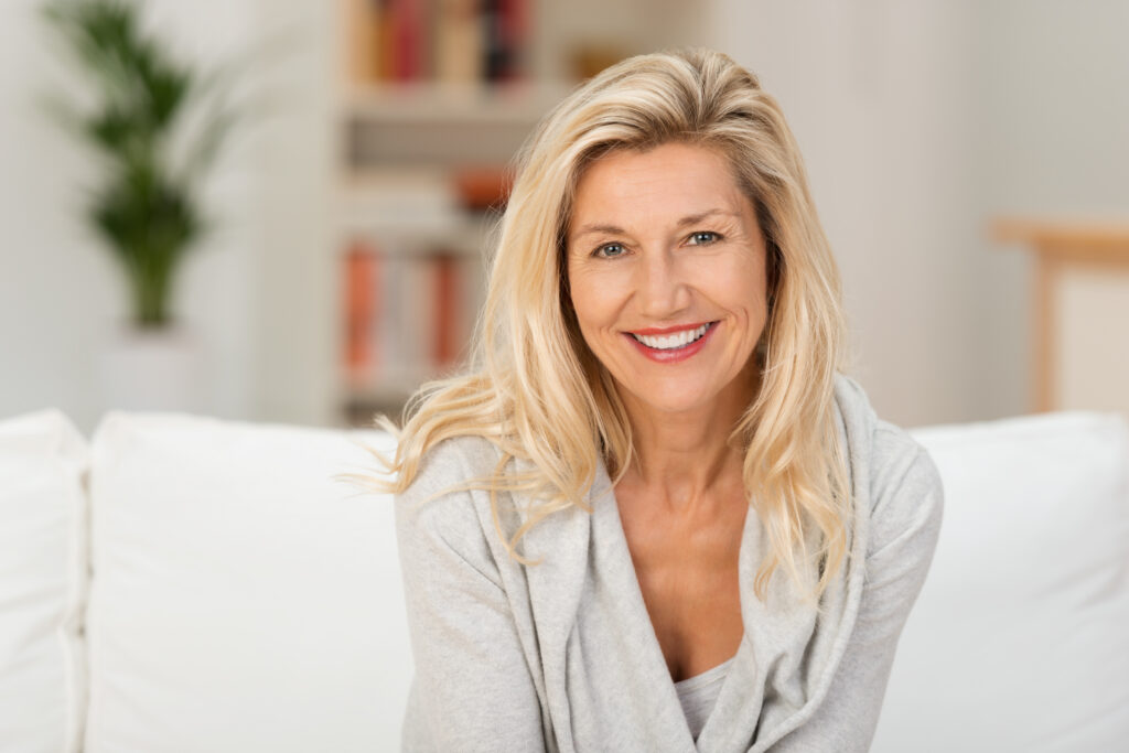 Private Dentist London - older woman sat down smiling