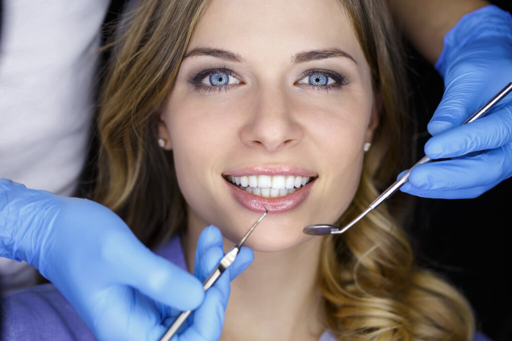 General Dentistry in Bayswater - Woman smiling with dental equipment
