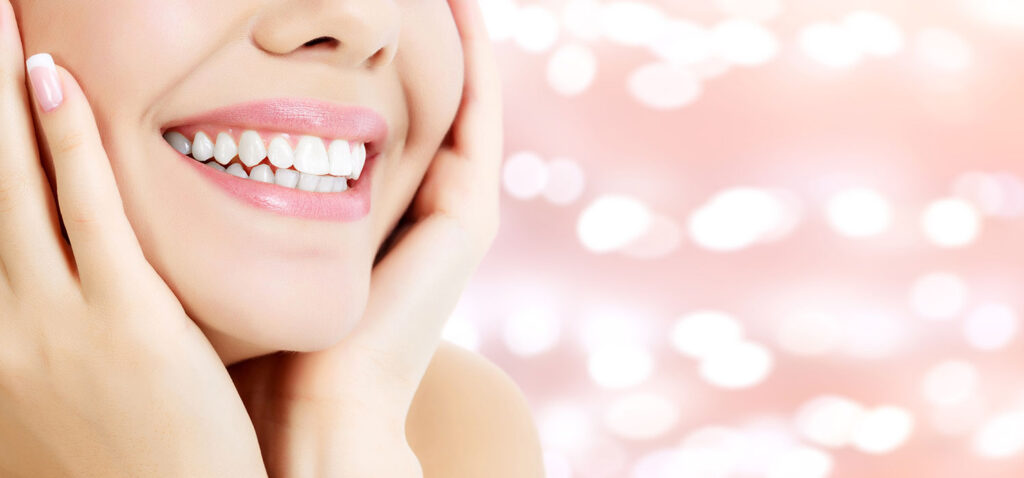 Girl smiling on pink background